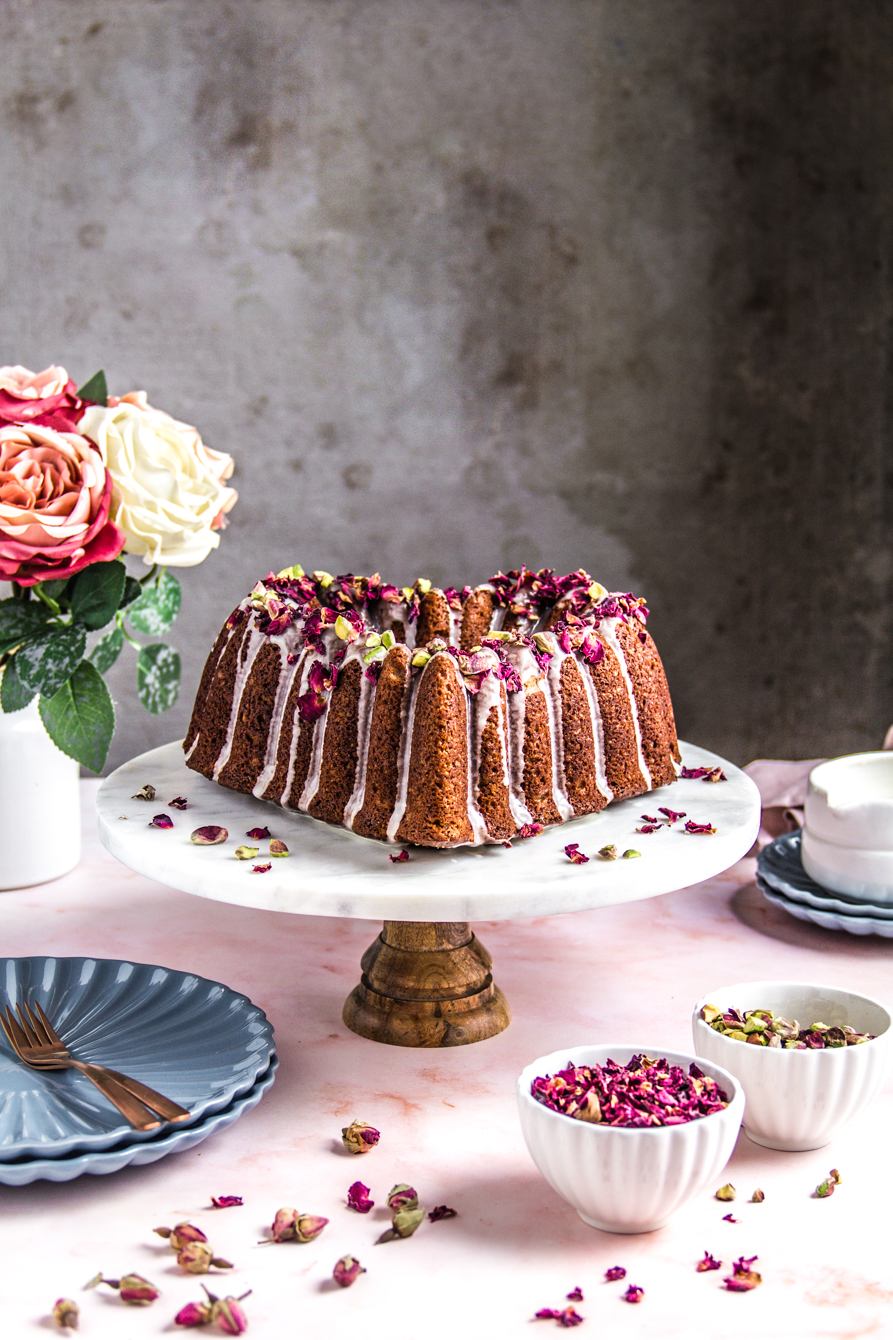Healthier Persian Love Cake, made with olive oil. A flavorful, delicious cake with rose water, citrus and cardammom and an aromatic icing.